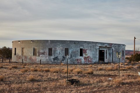 An old, abandoned concrete building whose uses are unclear still stands in the tiny, unincorporated community of Prewit…