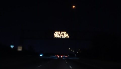 Variable-message sign on Stevenson Expwy at night