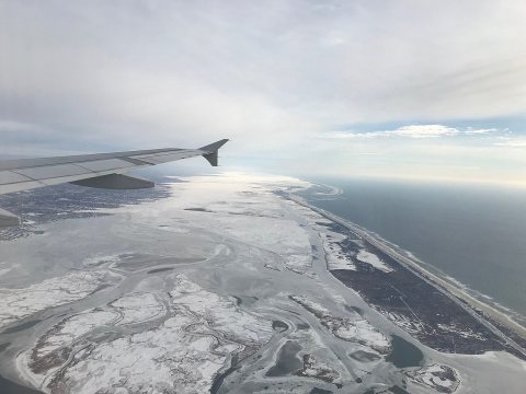 Flying over a City under Ice