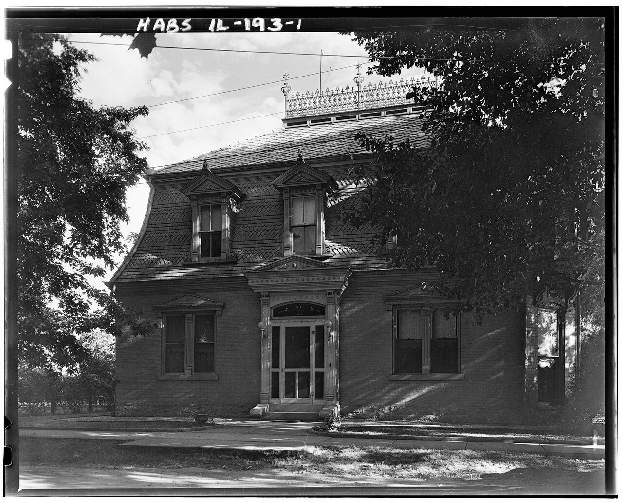 FRONT FACADE, SHOWING MANSARD ROOF WITH CRESTING - Brick House
