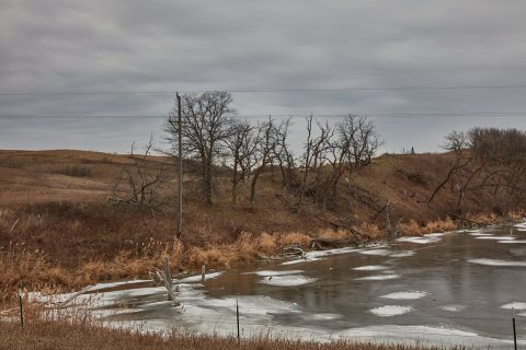 Dots of ice appear in late fall on a small lake outside Fort Totten, North Dakota