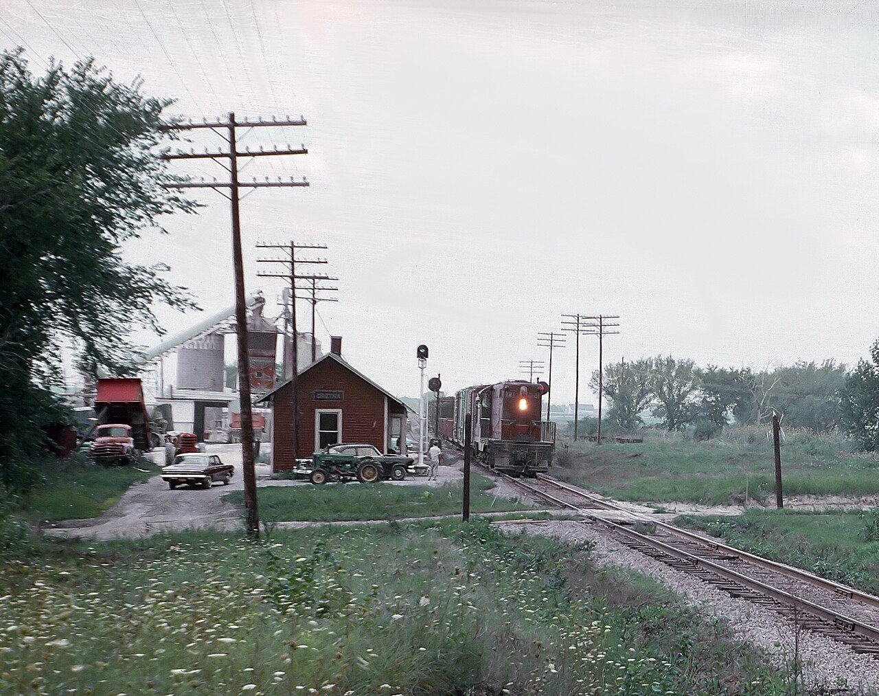 CGW 121 (GP7) eastbound peddler (local) freight at Gretna, IL station on August 14, 1962
