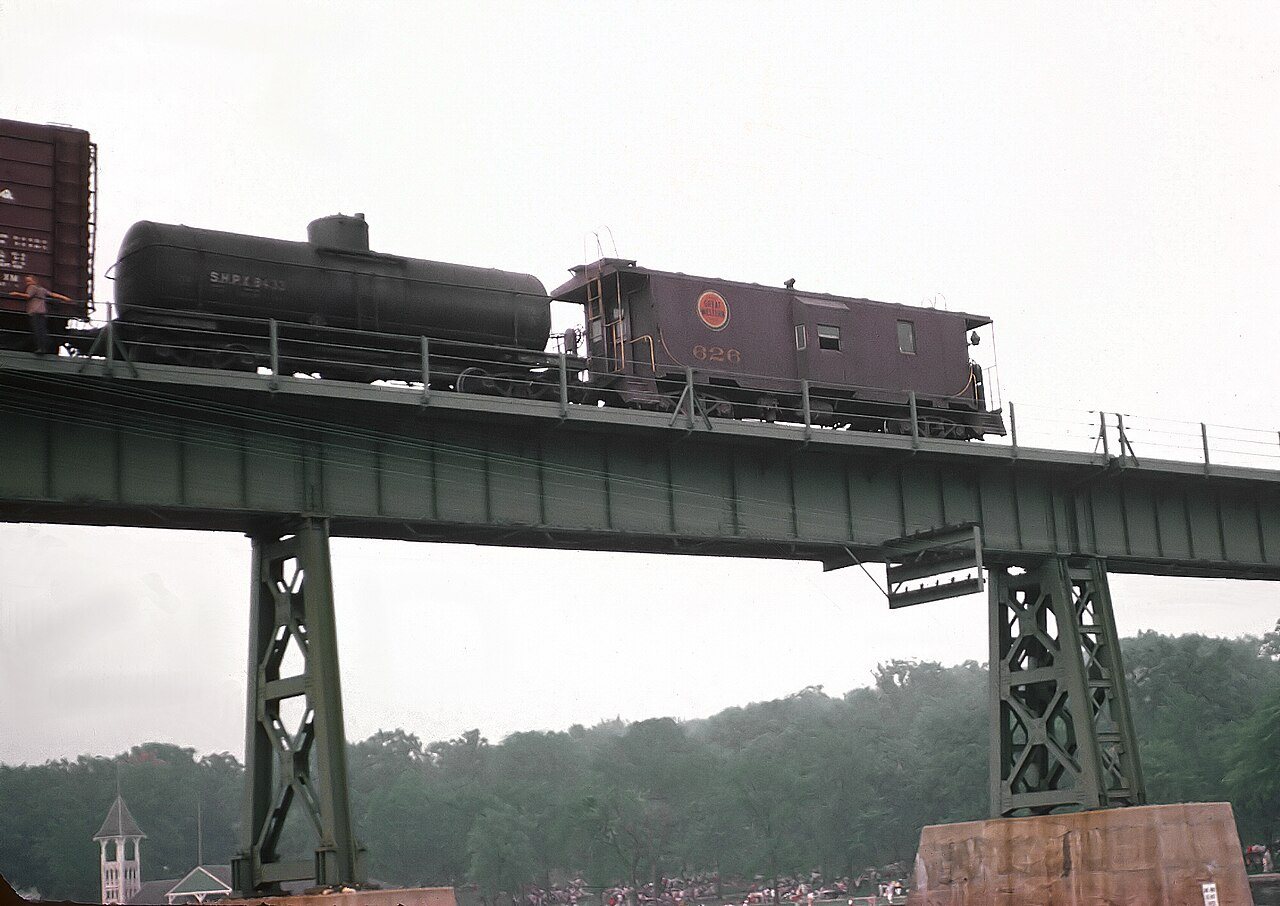 CGW 115-A (F5A) Caboose westbound freight -143 crossing over the Fox River at St. Charles, IL on July 4, 1962