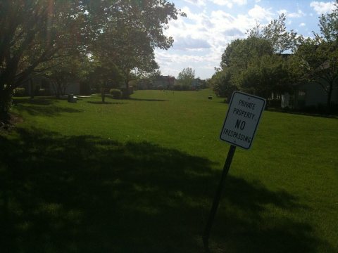 Facing the long strip of grassy lawn