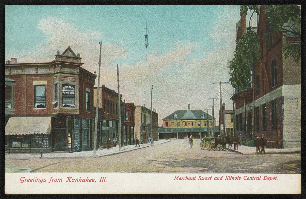 Greetings from Kankakee, Ill. Merchant Street and Illinois Central Depot