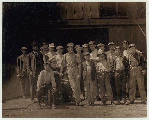 Group of glass workers at Shop 7, Illinois Glass Co. 12:30 P.M. One of the smallest boys is Dennis White, 1013 Liberty …