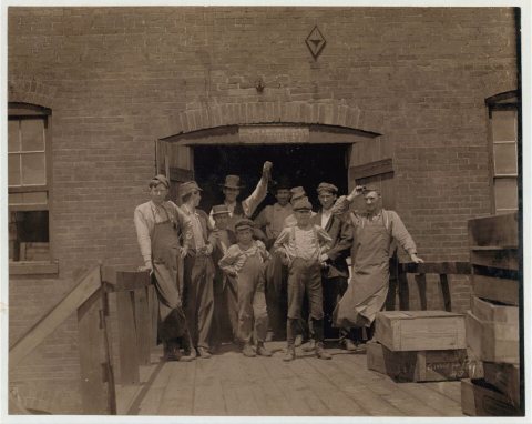 Group of Glass Workers in Shop 6, Illinois Glass Co. The smallest boy is Polish and does not understand English (illite…