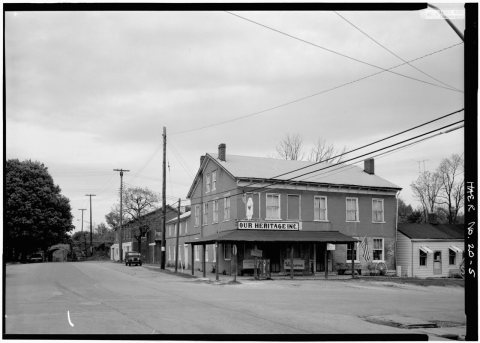 GENERAL VIEW FROM SOUTH TH NORTH SHOWING RAILROAD OVERPASS IN DISTANCE, DEPOT AND INN IN FOREGROUND - Madison and India…