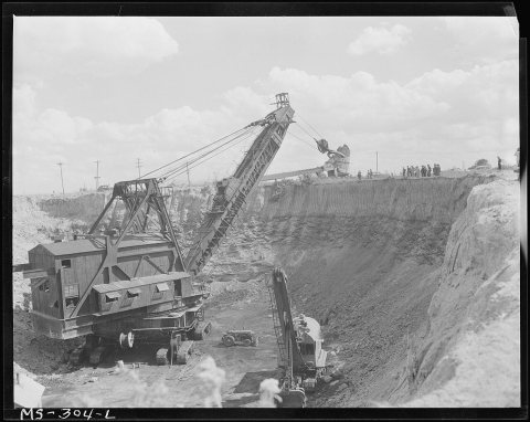 Travelling dipper shovel in operation at this strip coal mine. Ayrshire Colliers Company, Chinook Mine, Stauton, Clay C…