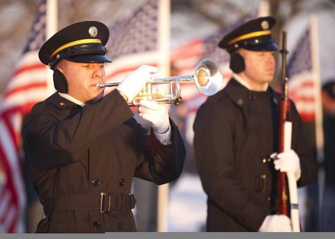 A U.S. Soldier plays taps during the funeral for Army Spc. Robert Tauteris Jr 120115-A-MG787-087