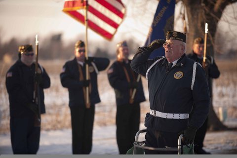 An American Legion member renders honors during the funeral for U.S. Army Spc. Robert Tauteris Jr 120115-A-MG787-065