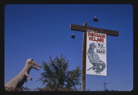Dinosaur Village RV Mobile Home Park, dinosaur statue and sign, Route 40