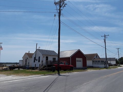 Willis Wharf, shacks along the water