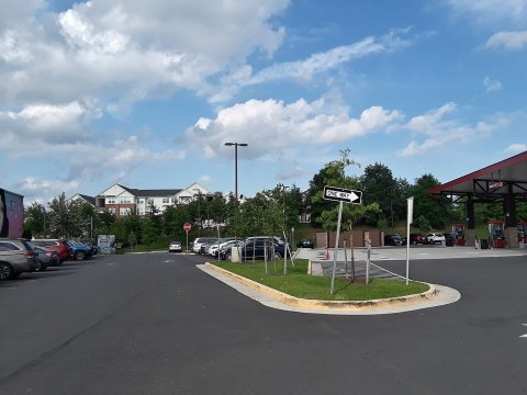 Parking lot with Sheetz and apartments in the rear