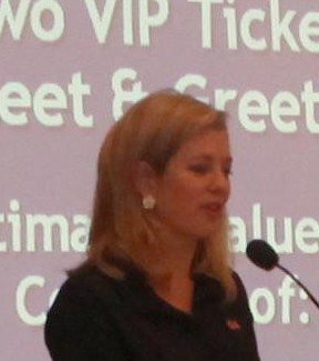 Brianna Keilar, the master of ceremonies and CNN White House correspondent, auctions off prizes at the 10th Anniversary…