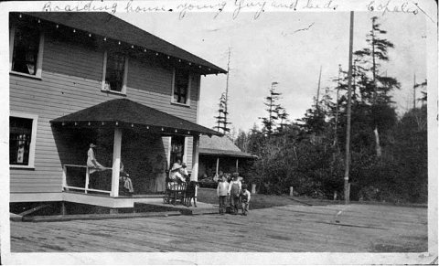 Women and children gathered on porch of boarding house, Copalis, ca. 1912