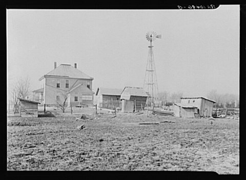 House and outbuildings on William Weltis' farm near Boswell, Indiana. This fourteen hundred acre farm is owner-operated…