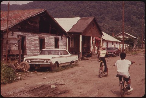 RAND, WV., WITH MUCH OF ITS POPULATION LIVING IN POVERTY, HAS MANY UNPAVED ROADS, SUBSTANDARD HOUSES, AND JUNKED AUTOMO…