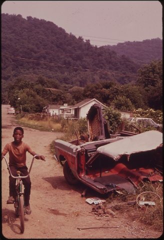 RAND, WV., WITH MUCH OF ITS POPULATION LIVING IN POVERTY, HAS MANY UNPAVED ROADS, SUBSTANDARD HOUSES, AND JUNKED AUTOMO…