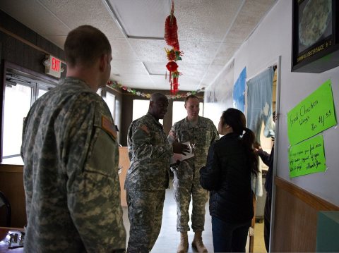 From left, U.S. Army Maj. Drew Smith, the deputy commander of the District of Columbia National Guard's 33rd Civil Supp…