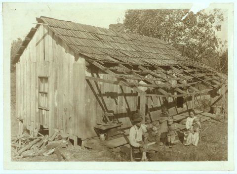 Frank Burditt and family. They rent this dilapidated shack and are trying to make a living off the meagre land near by.…