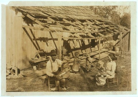 Frank Burditt and family. They rent this dilapidated shack and are trying to make a living off the meagre land near by.…