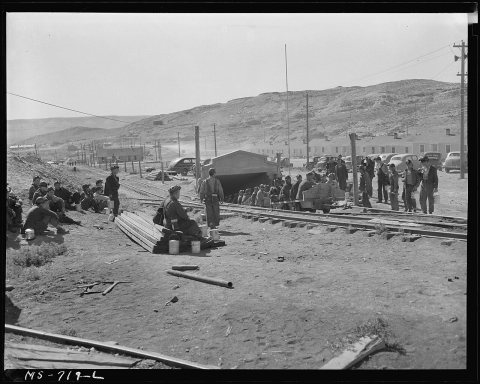 Changing shifts. Morning shift is being brought up on cars from underground. Miners of the afternoon shift are... - NAR…