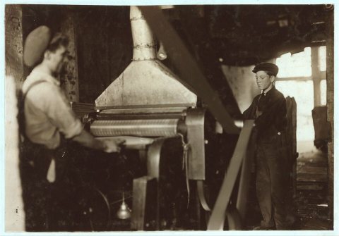 Boy at planing machine, Ind[iana] Mfg. Co. Location: Peru, Indiana