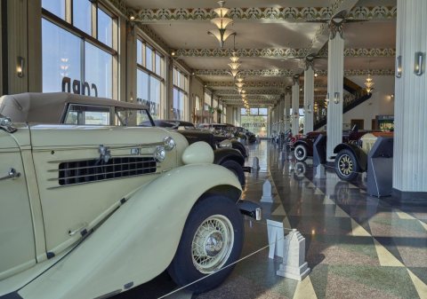A 1936 Auburn 654 appears in the foreground of this photo of the Auburn Automobile Company Showroom, now the Auburn Cor…