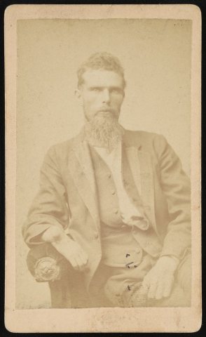 Leeotolis Hardy, half-length portrait, seated, facing front