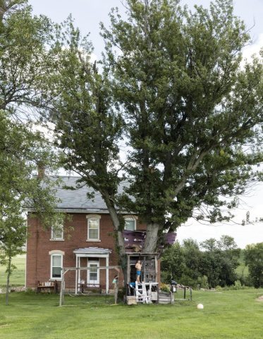 Kids enjoy the family treehouse outside Sherrill, Iowa