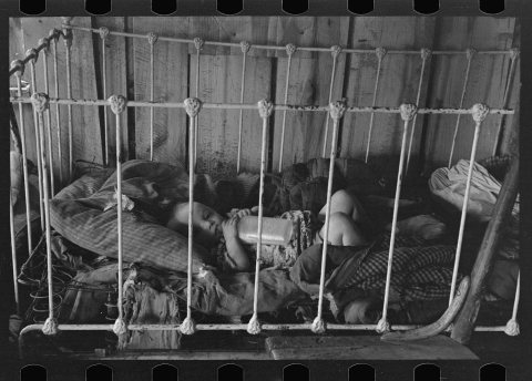Baby in crib, Earl Pauley's home near Smithland Iowa