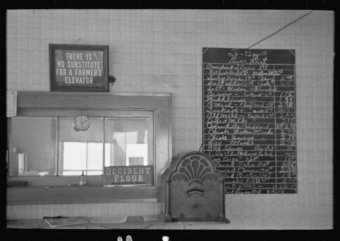 Signs in a cooperative elevator at Ruthven, Iowa