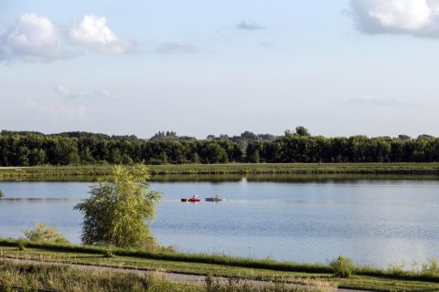 Rowers enjoy a summer day at Grundy County Lake near the town of Dike, Iowa