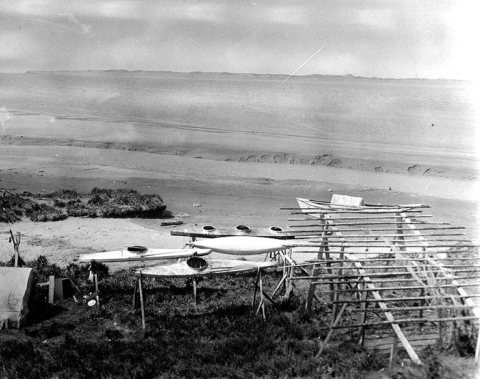 Eskimo bidarkas (skin covered boats)on the beach at Egegik, Alaska, ca. 1917
