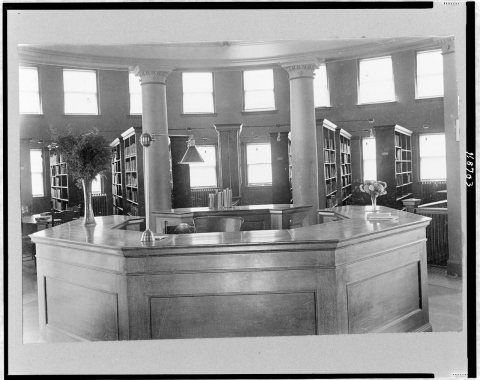 Interior of public library, showing central desk