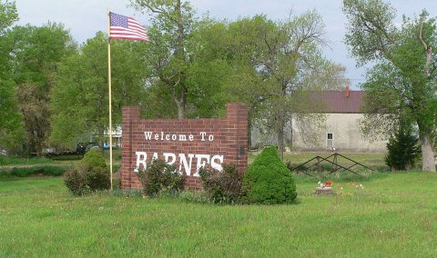 Barnes, Kansas welcome sign and kingpost bridge 1