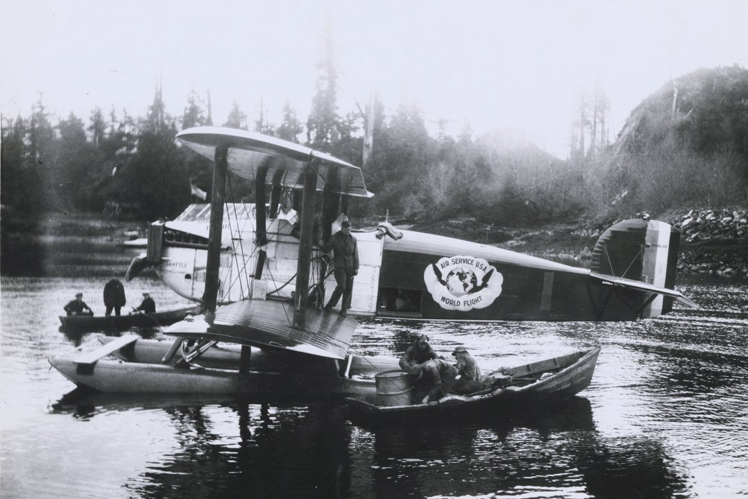 Douglas World Cruiser "Seattle" aircraft being serviced by men in rowboat