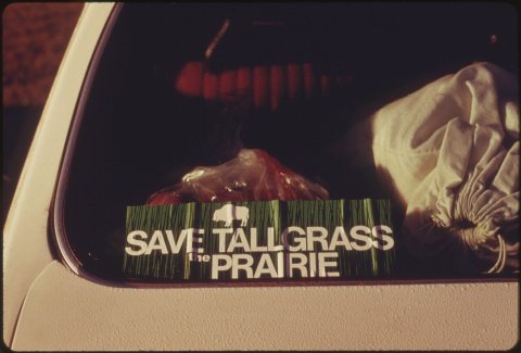REAR WINDOW OF A CAR SHOWS A "SAVE THE TALLGRASS PRAIRIE" STICKER. THE DRIVER WAS ATTENDING THE SECOND ANNUAL... - NARA…