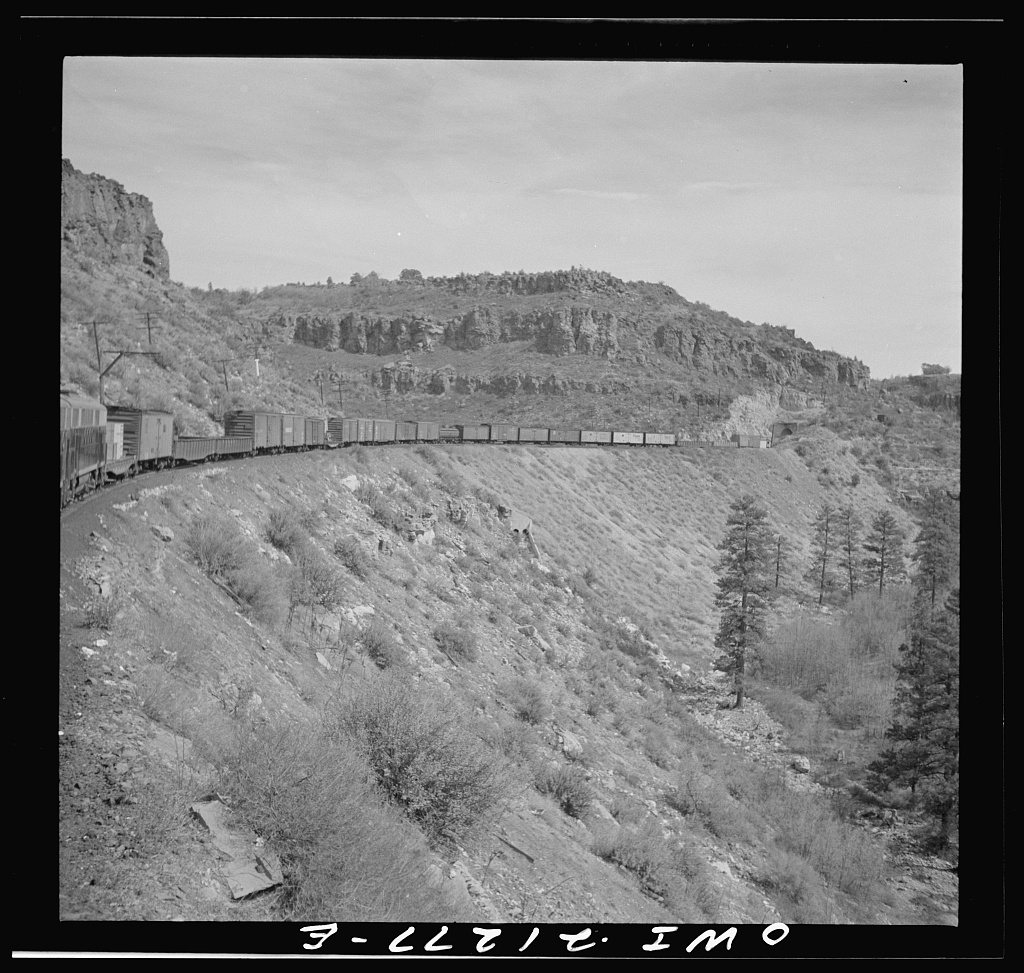 Williams (vicinity), Arizona. A train on the Atchison, Topeka and Santa Fe Railroad between Winslow and Seligman, Arizo…