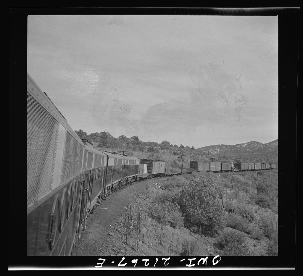 Williams, Arizona. A diesel freight train climbing through mountainous area along the Atchison, Topeka, and Santa Fe Ra…