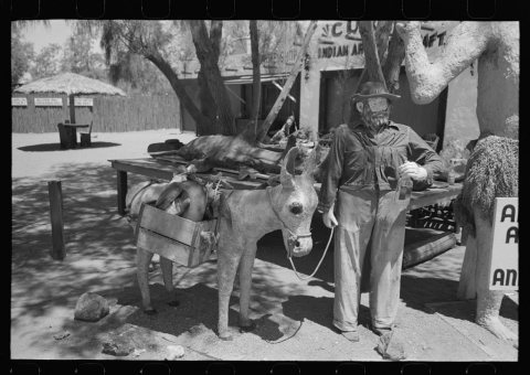 Figure of a miner and his donkey made of papier mache