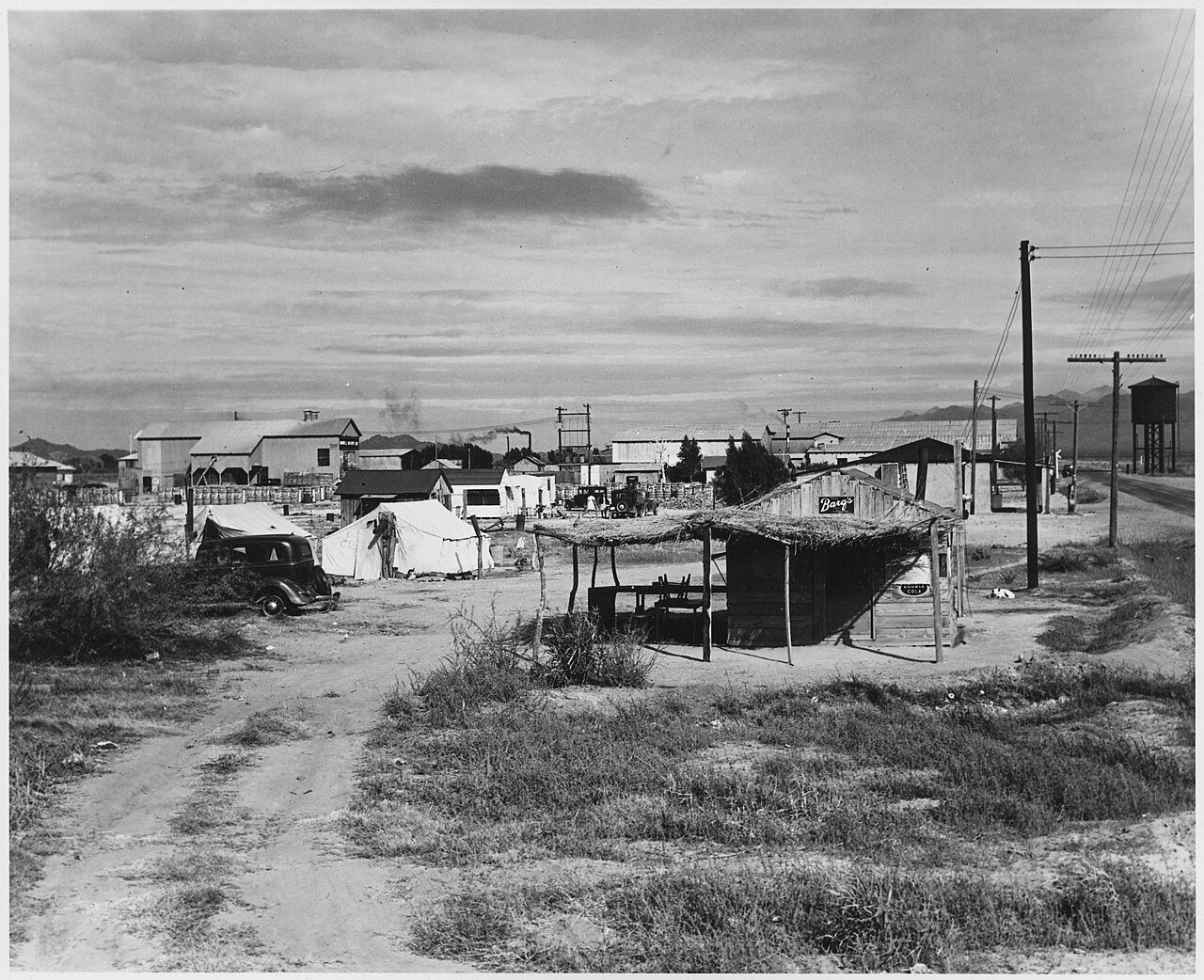 Buckeye, Maricopa County, Arizona. Private auto camp for cotton pickers, camp manager's store in for