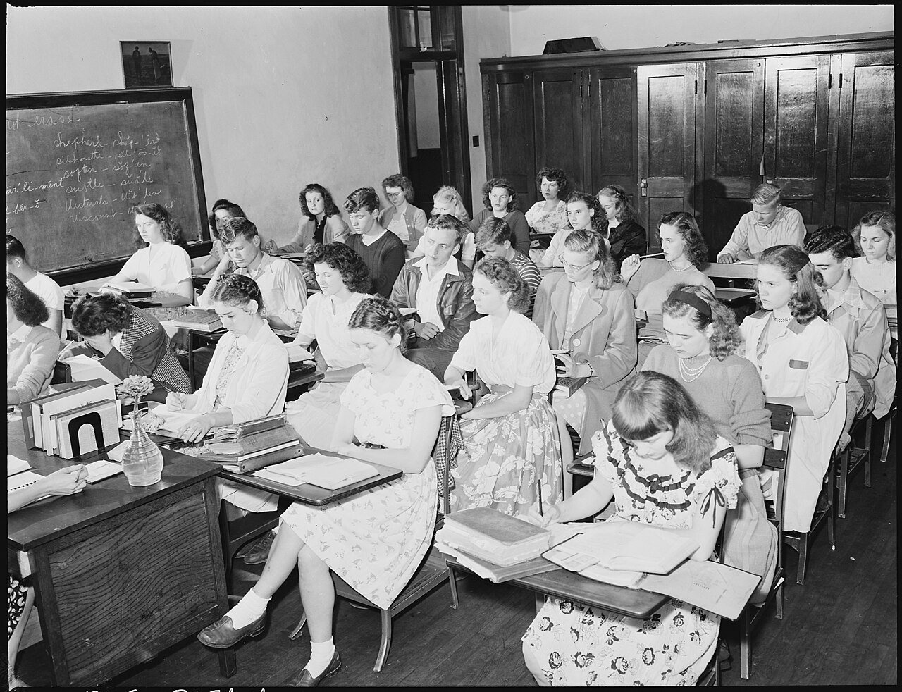Class in high school which George Fain (center) son of Harry Fain, coal loader, attends. He is a veteran who is in... -…