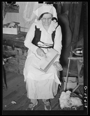 Madame Dronet carding cotton. Erath, Louisiana
