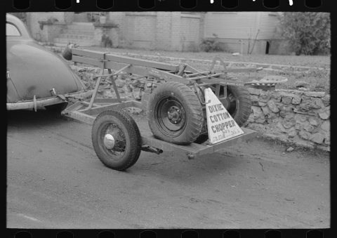Untitled photo, possibly related to: Cotton chopper mounted on automobile trailer