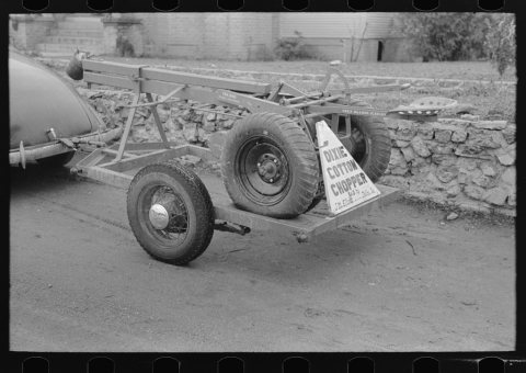Cotton chopper mounted on automobile trailer