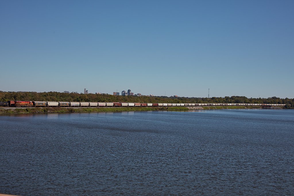 A long train passes Cross Lake near Blanchard, Louisiana