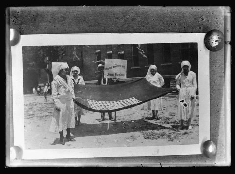 Parade: girls with service flag, Gulf Div
