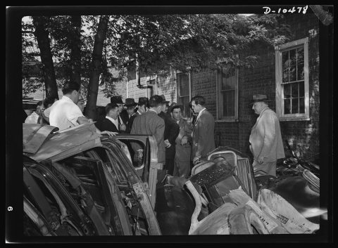 Salvage. Requisitioning auto graveyard. Standing among the piles of reclaimable materials at the Colmar Manor, Maryland…
